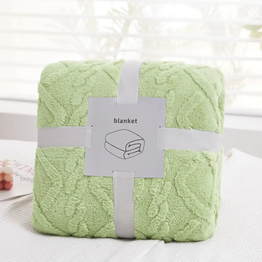 A soft light green plush blanket with a quilted diamond pattern perfect for cozy jacquard plush decorbites living room throw