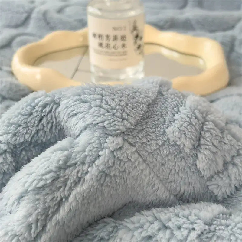 Soft light blue plush cozy jacquard taffeta flannel nap blanket with fluffy textured surface for bedroom comfort