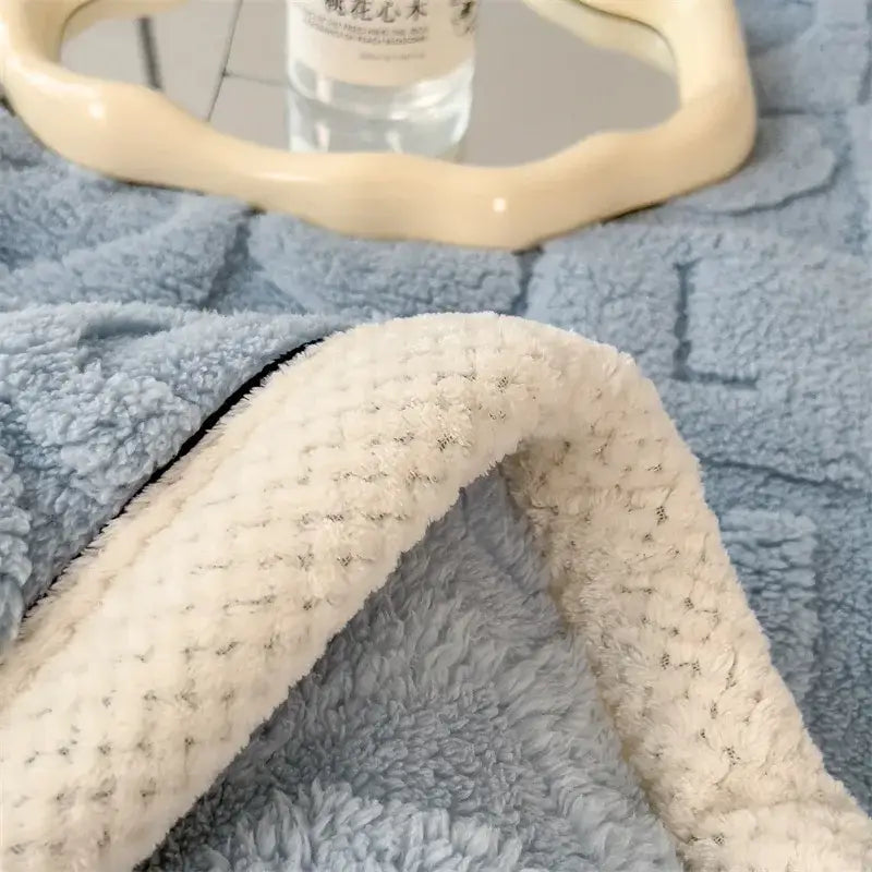 Soft blue and cream cozy jacquard taffeta flannel nap blanket with textured plush fleece surface for bedroom comforter decorbites