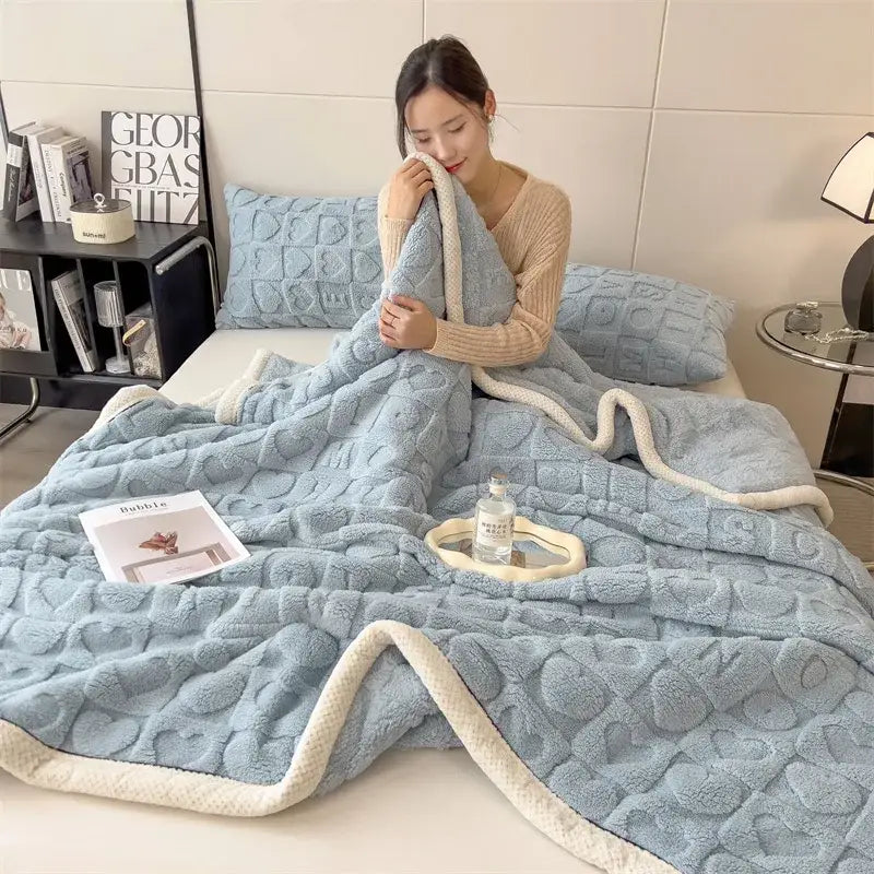 Soft light blue plush cozy jacquard taffeta flannel nap blanket with textured pattern and cream fleece border by decorbites