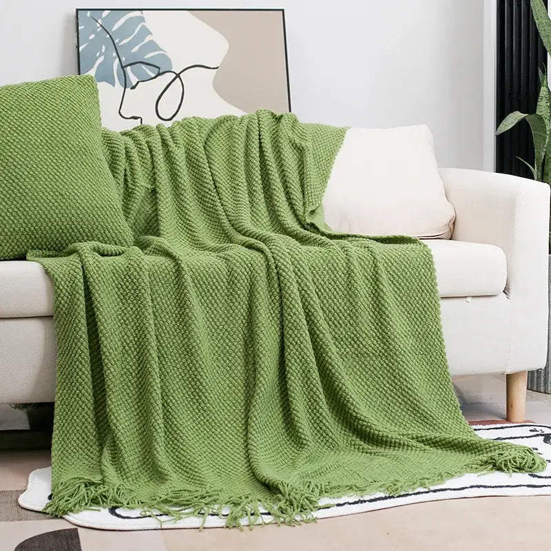 A cozy knitted sofa green knit throw blanket with diamond pattern and fringed edges decorbites cozy knitted decor