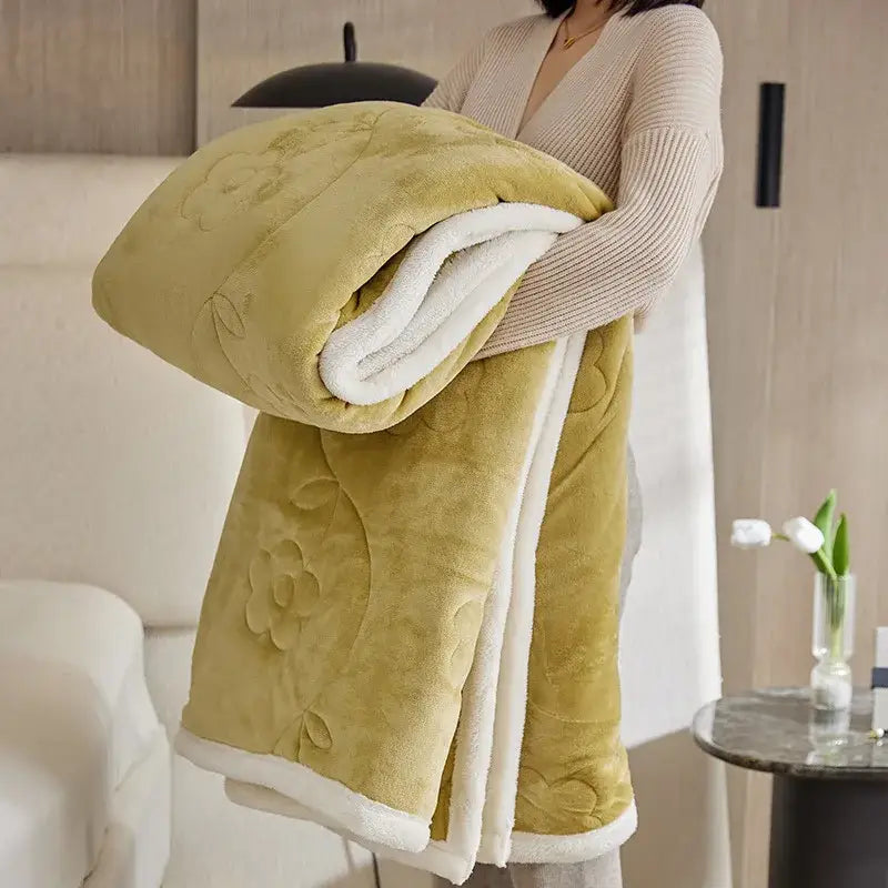 A plush olive green wool sofa blanket with soft white sherpa lining and floral embroidery by decorbites cozy