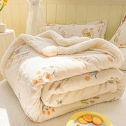 A cozy milk velvet floral fleece blanket in cream with plush texture and orange green patterns for bedroom decorbites cozy milk