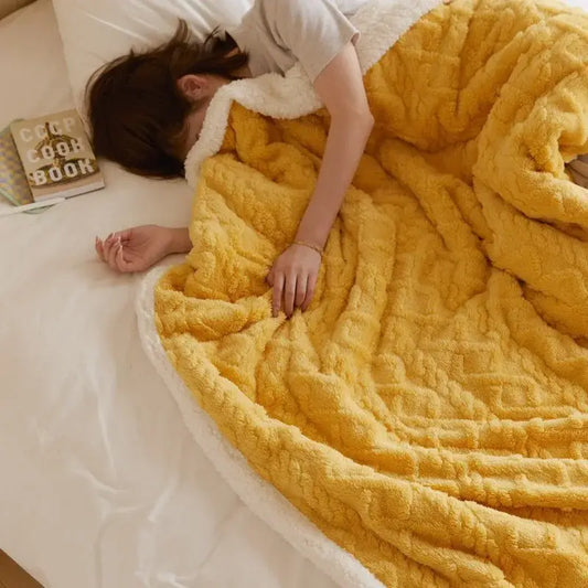 Cozy mustard yellow coral fleece blanket with plush white sherpa lining ideal for bedroom use