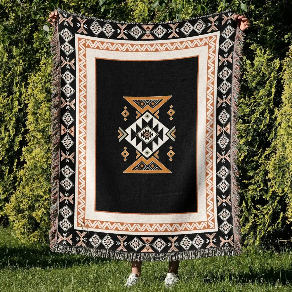 Black cozy nordic camping blanket with central geometric pattern and fringed edges perfect for living room decorbites cozy nordic