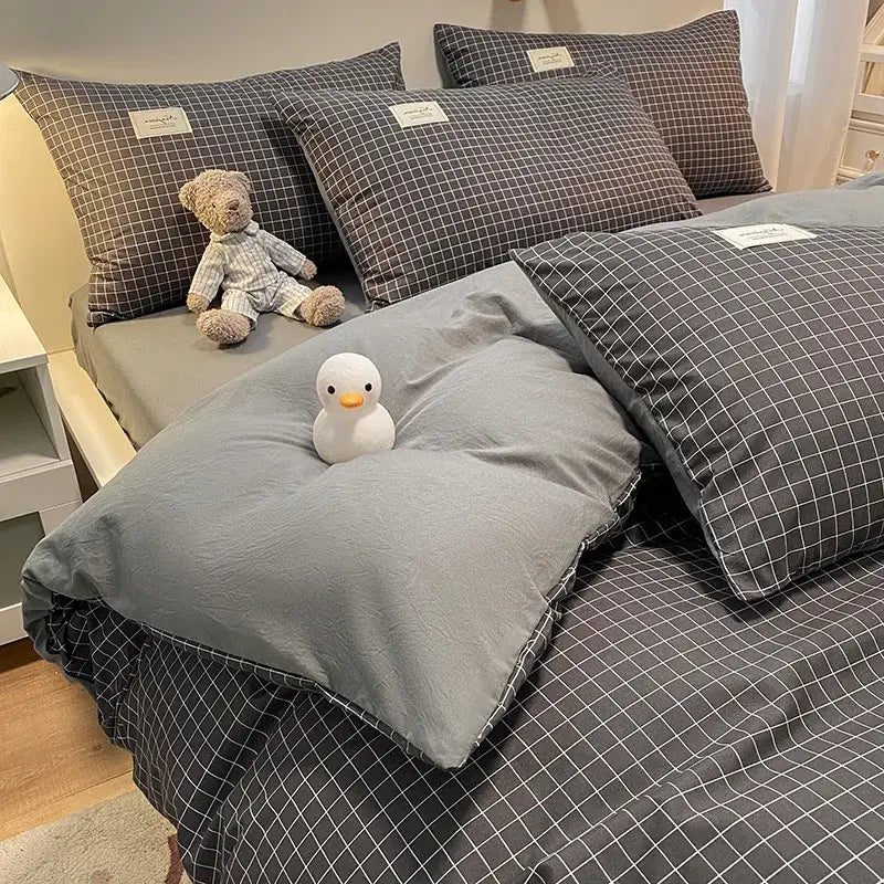 Gray and white checkered pillowcases with small rectangular labels from decorbites cozy plaid duvet cover bedding set