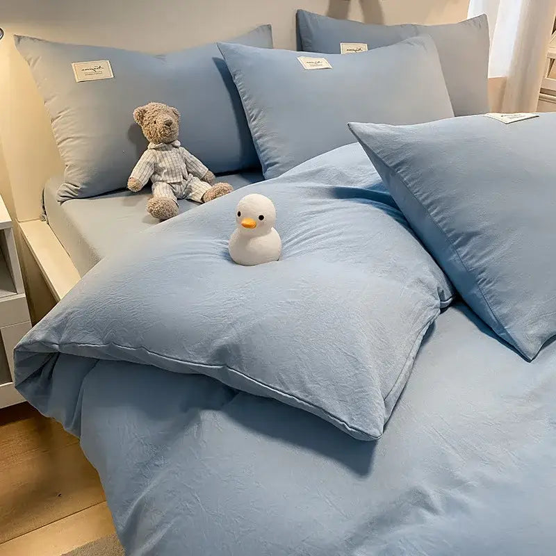 Soft light blue cotton bedding set with matching pillows and plush teddy bear featuring decorbites cozy plaid duvet cover
