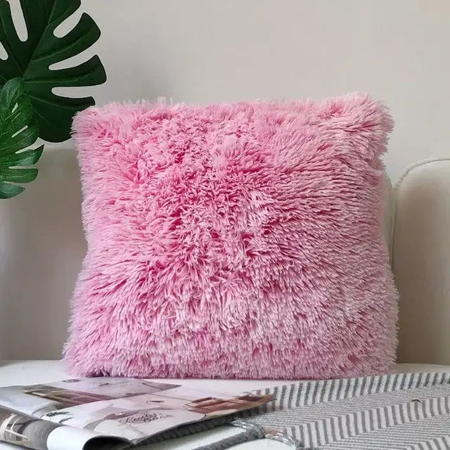 A pink cozy plush fur cushion cover with shaggy faux fur texture ideal for decorbites cozy plush decor