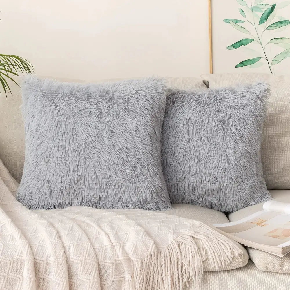 Soft light gray faux fur throw pillows with a shaggy texture cozy plush fur cushion cover by decorbites for living room decor