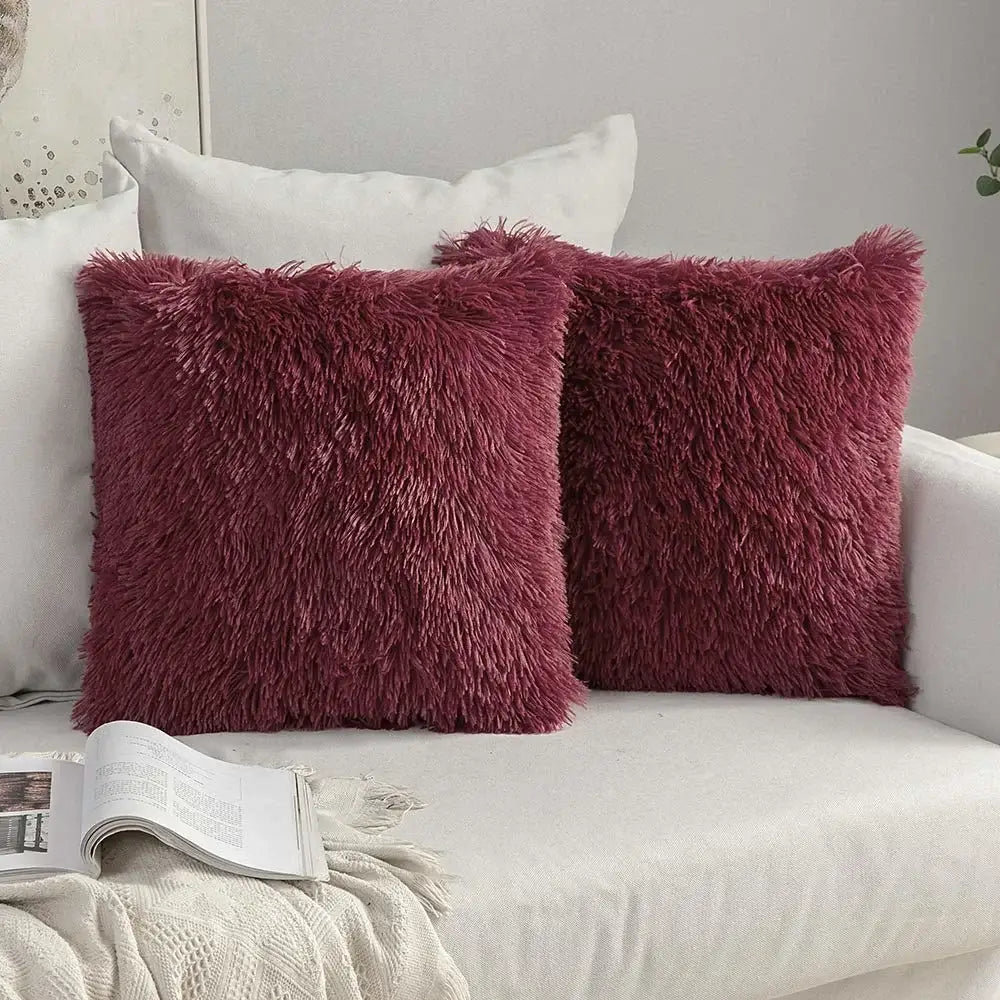 Two deep burgundy plush fur cushion covers with a soft shaggy texture from decorbites cozy plush collection for living room decor