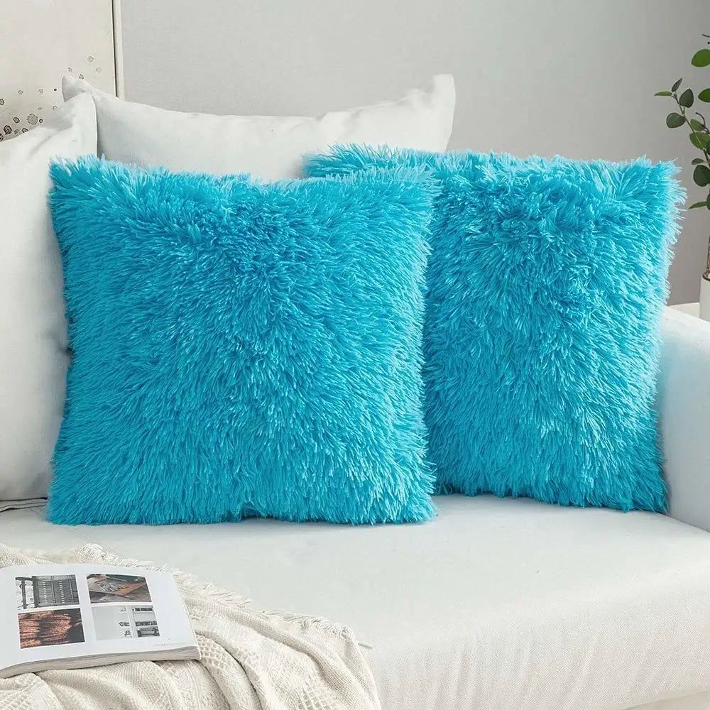 Two vibrant turquoise cozy plush fur cushion covers with a shaggy texture for decorbites cozy plush living room decor