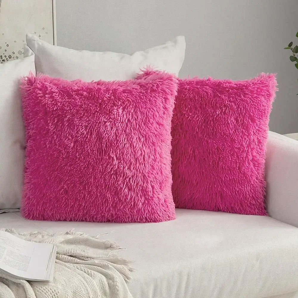 Two vibrant fuchsia cozy plush fur throw pillows with shaggy texture complement decorbites cushion cover decor