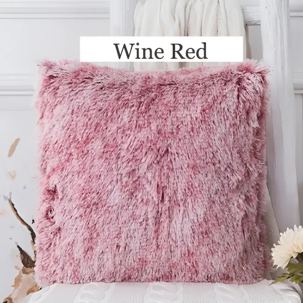 Wine red fluffy throw pillow with soft shaggy texture and pinkish hue for decorbites cozy plush fur cushion cover