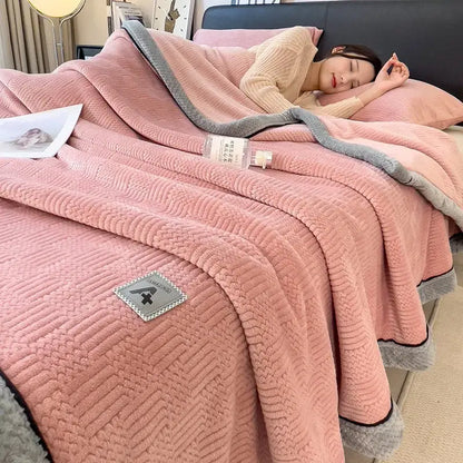 Pink plush blanket with gray border and textured weave featuring a small patch in decorbites cozy striped knitted velvet style