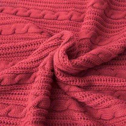 Cozy crimson cable-knit cushion cover with tassels and textured interwoven pattern for decorbites knit pillow use