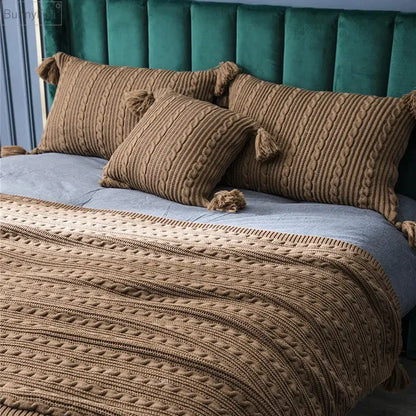 Warm brown cable knit cushion cover with tassels made of knitted material for living room or bed decorbites knit pillow