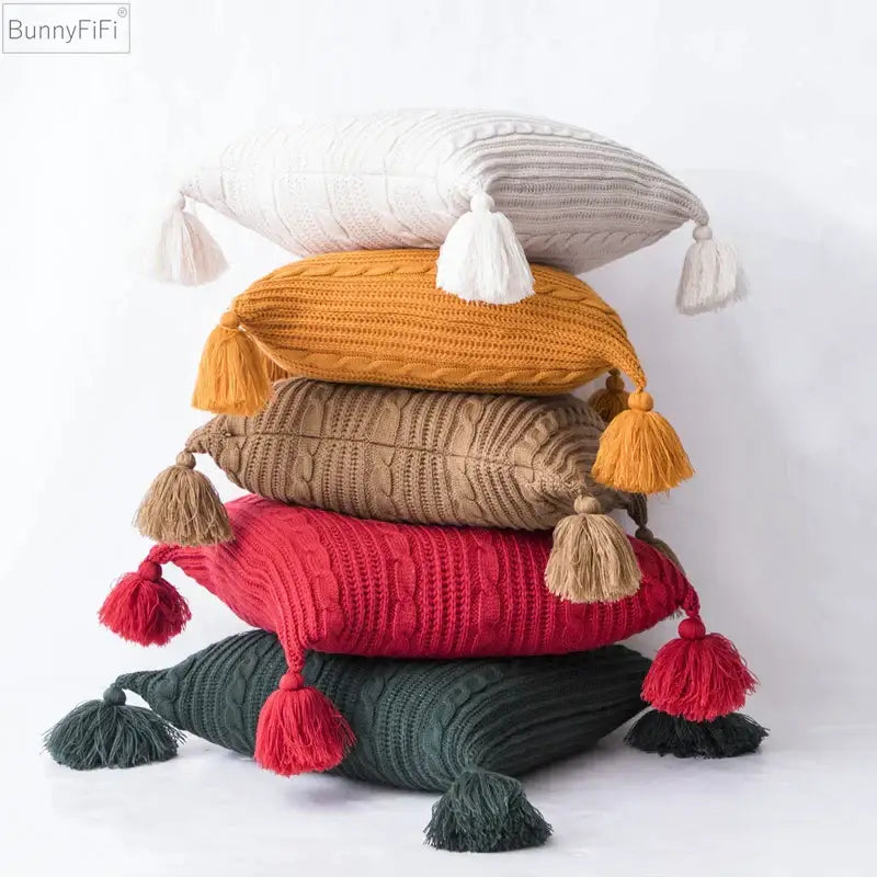 Cozy textured knit cushion cover in warm tones with tassels and cable-knit yarn for living room decorbites knit pillow