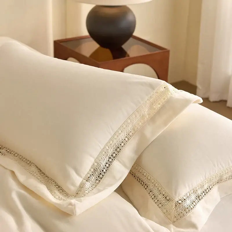 Cream-colored bedding set pillowcases with delicate lace trim from decorbites cozy velvet lace collection