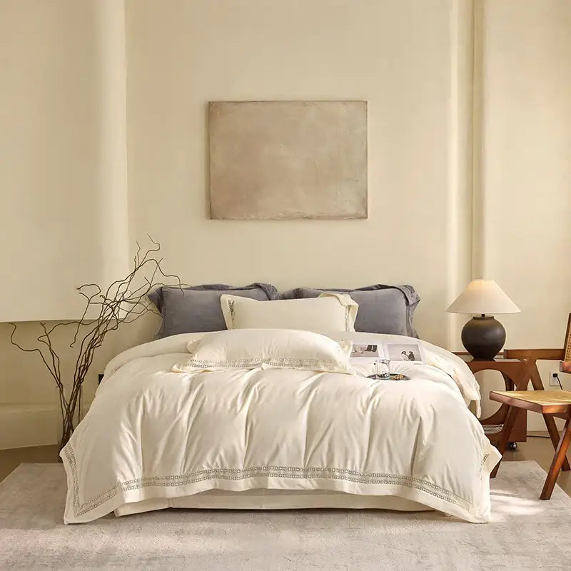 Cream-colored quilted duvet cover with delicate embroidered trim from decorbites cozy velvet lace bedding set