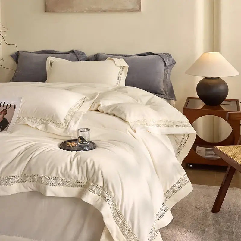 Cream-colored satin bedding set with delicate lace trim from decorbites cozy velvet lace bedroom decor collection