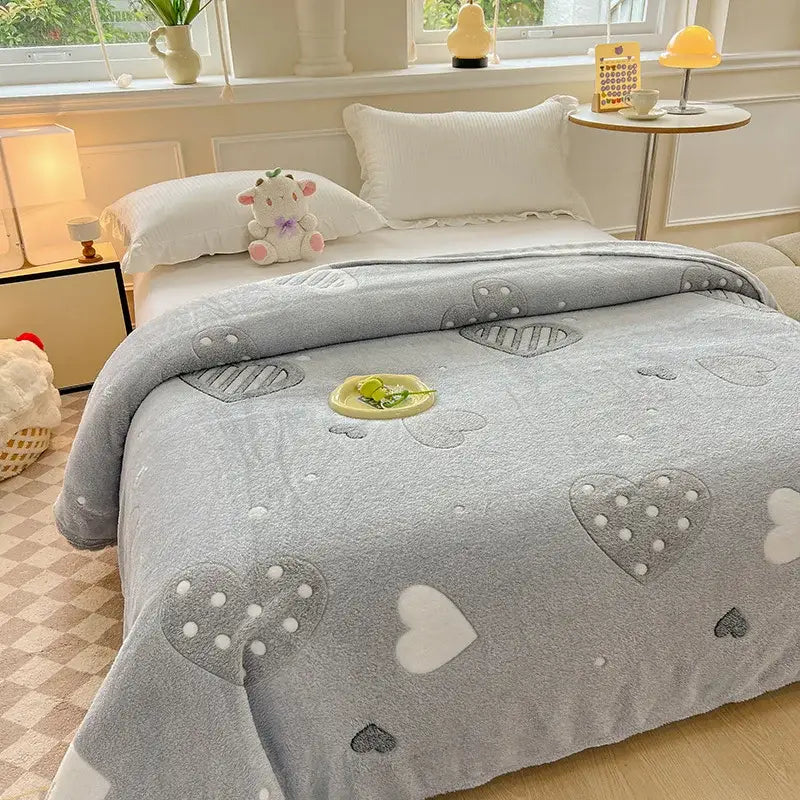 Soft gray plush blanket with embroidered hearts and dotted accents complements colorful flower patterns bedroom decor