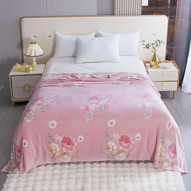 Cozy pink floral throw blanket with soft plush texture and colorful flower patterns for bedroom decor