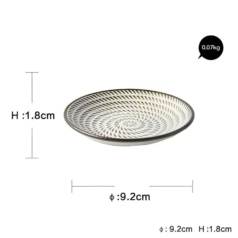 A white ceramic dinner plate set with black rim and intricate woven pattern for decorbites ceramic dinner use