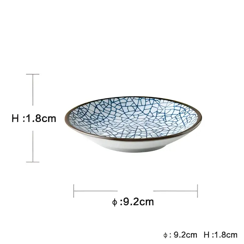A delicate white ceramic dinner plate with blue crackle glaze and dark brown rim from decorbites ceramic dinner set