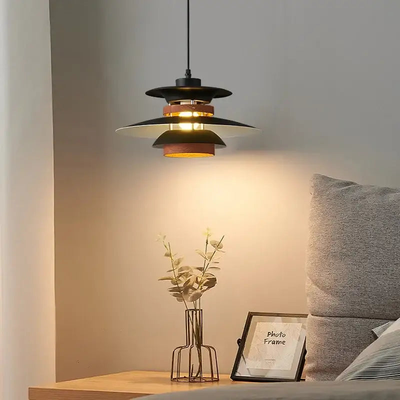 Black and copper layered pendant light with modern tiered design complementing decorbites colorful umbrella shape chandelier