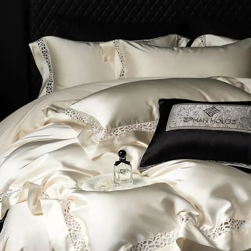 Cream and black egyptian cotton bedding set with decorbites brocade lace trim and black pillow with ephain house logo embroidery
