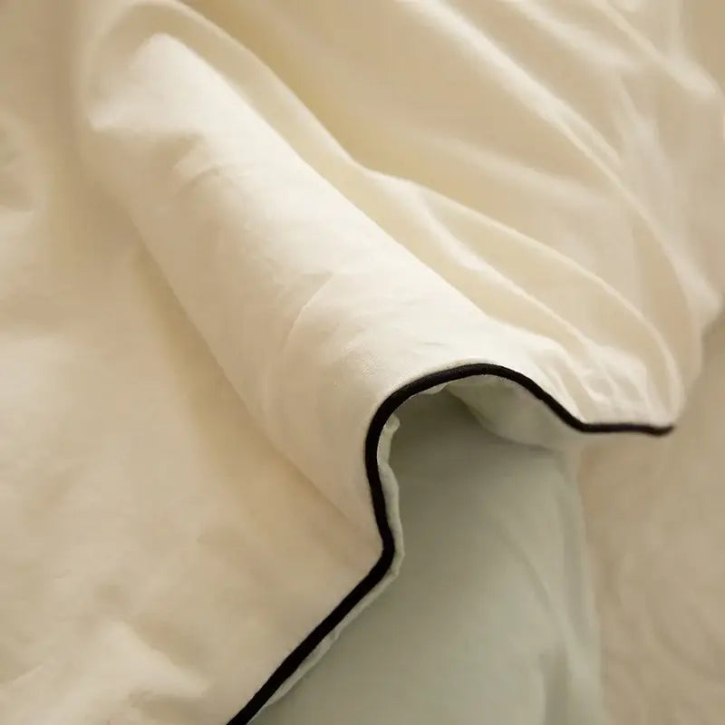 Cream-colored linen duvet cover with delicate black trim from decorbites ice cream cool feel summer quilt bedroom set