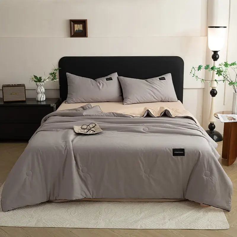 Gray quilted comforter with subtle stitching and black brand tag from decorbites ice cream cool feel summer quilt set