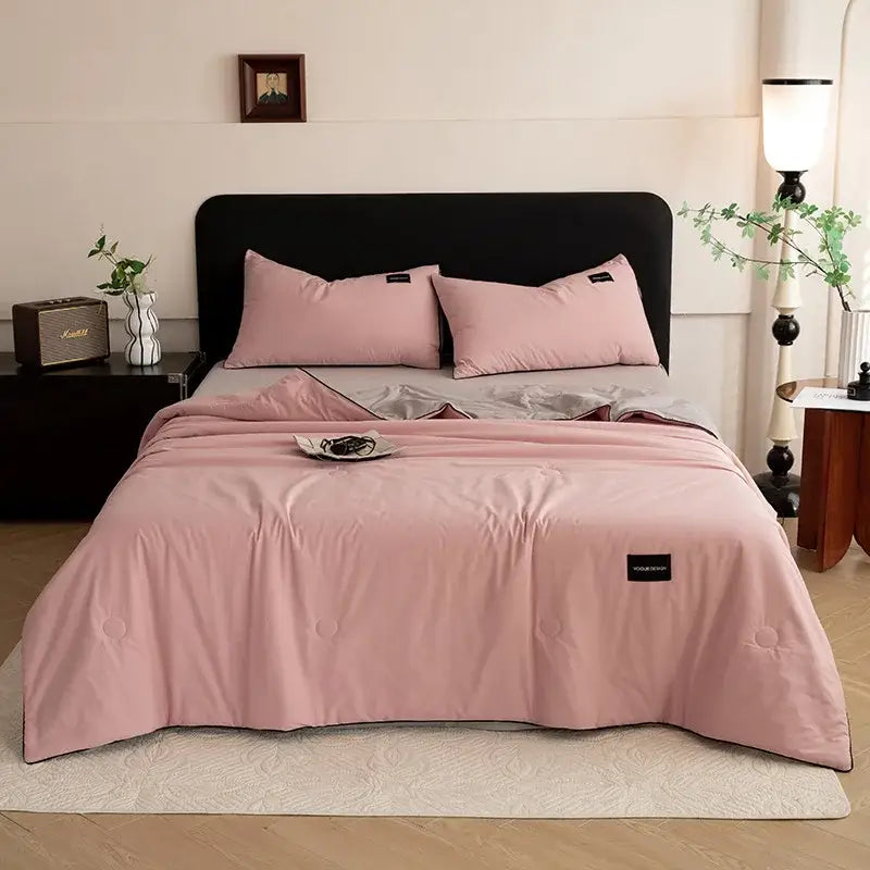 Pink quilted comforter with subtle black trim and branded patch from decorbites ice cream cool summer quilt set