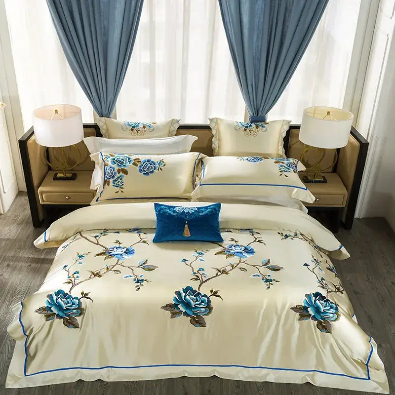 Cream and blue 200s embroidery egyptian cotton bedding set with intricate embroidery and matching pillowcases displayed