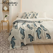 Cream and blue cute sea horse cotton knit throw blanket with playful sea horse pattern for bedroom decorbites cute sea