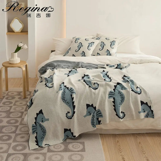 Cream and blue cute sea horse cotton knit throw blanket with playful sea horse pattern for bedroom decorbites cute sea