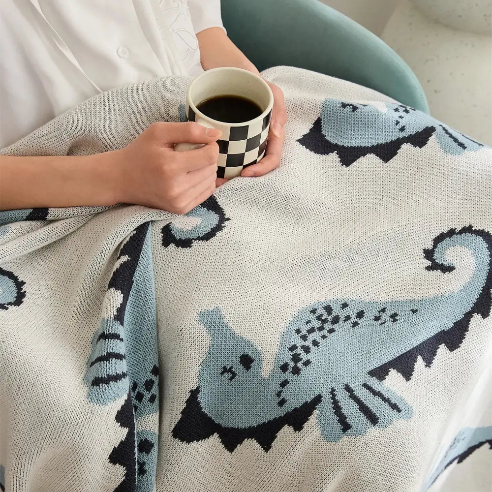 Cozy cream and blue cute sea horse cotton blanket featuring knitted seahorse designs for bedroom decorbites decor