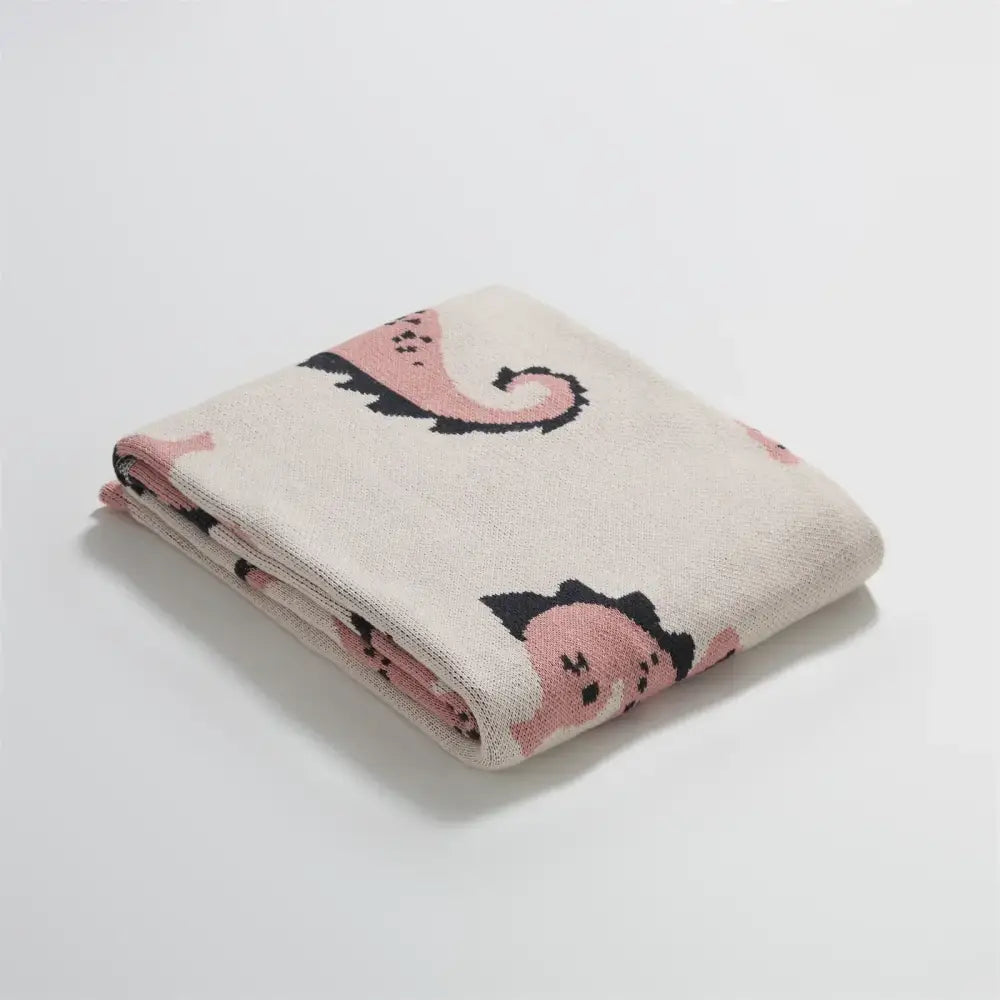 Cream and blue cute sea horse cotton blanket with soft cream knit and playful pink and black sea horse pattern