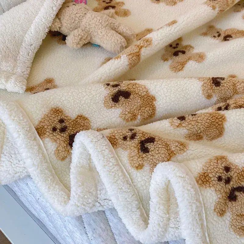 Cream and brown bear lamb plush blanket with soft textured fleece surface and embroidered teddy bear patterns