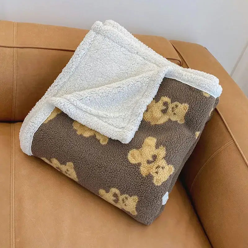 A cozy brown and cream bear lamb plush fleece blanket with yellow teddy bears and soft white sherpa lining