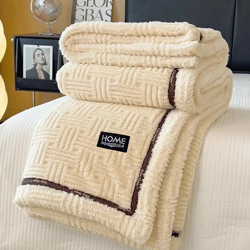 Cream and brown decorbites fluffy fleece blanket with woven geometric pattern and black home label for bedroom decor