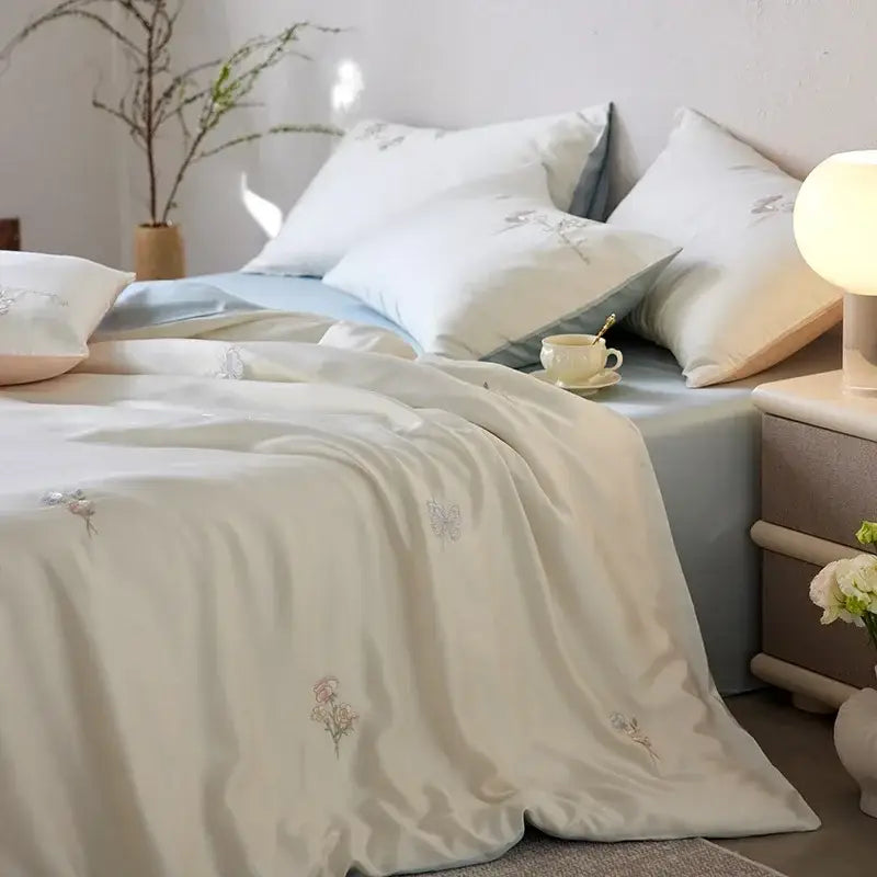 Cream and green cartoon embroidery comforter set with cream satin duvet cover featuring delicate pastel floral embroidery decorbites cartoon embroidery