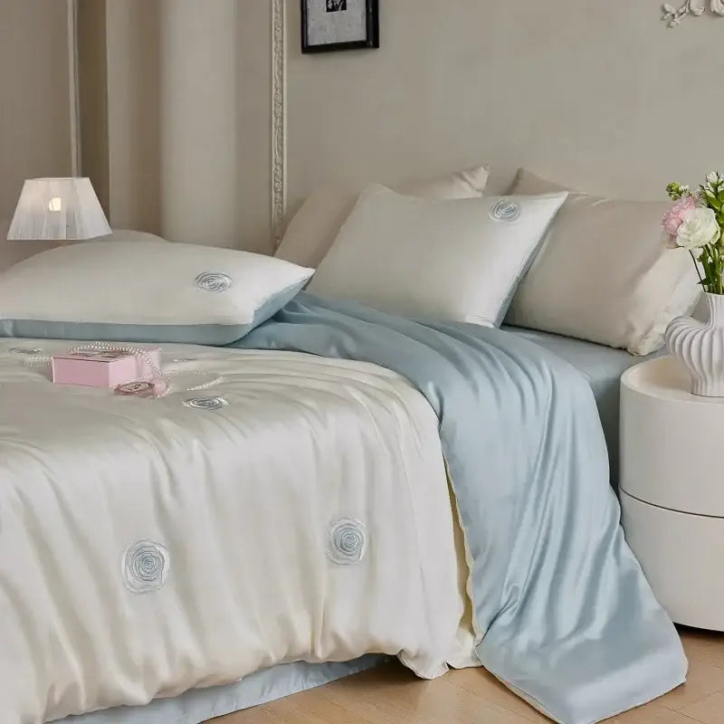 Cream and green cartoon embroidery comforter set with cream satin duvet cover and light blue embroidered rose motifs decorbites cartoon embroidery