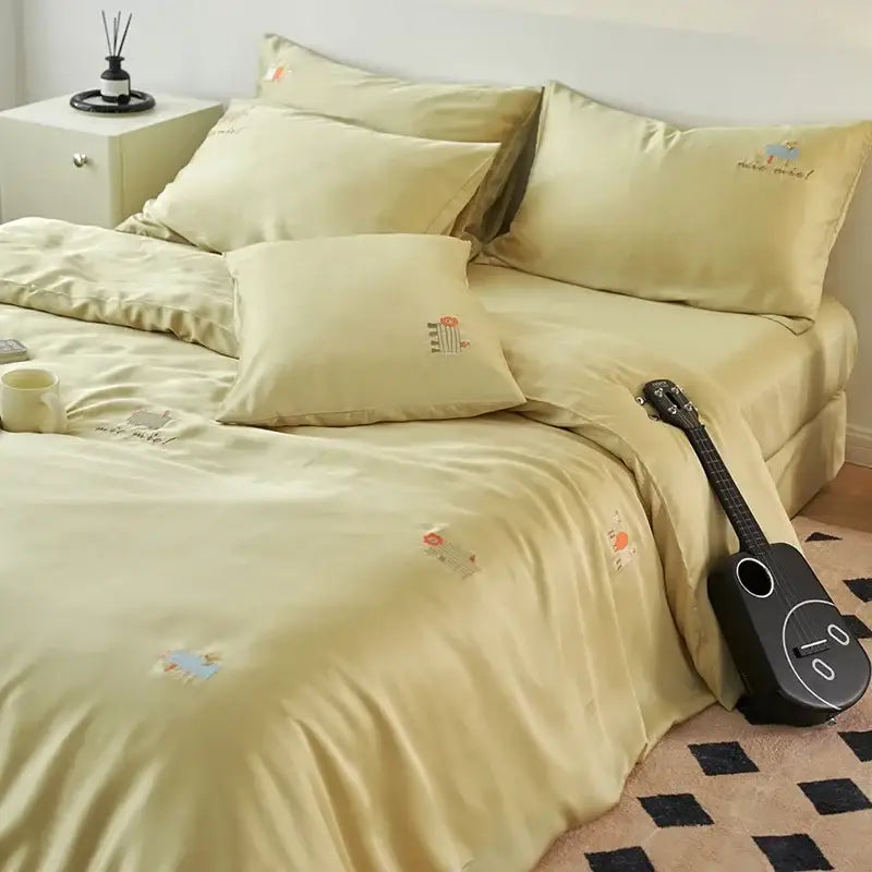 Soft pale yellow satin comforter set with delicate decorbites cartoon embroidery for bedroom bedding