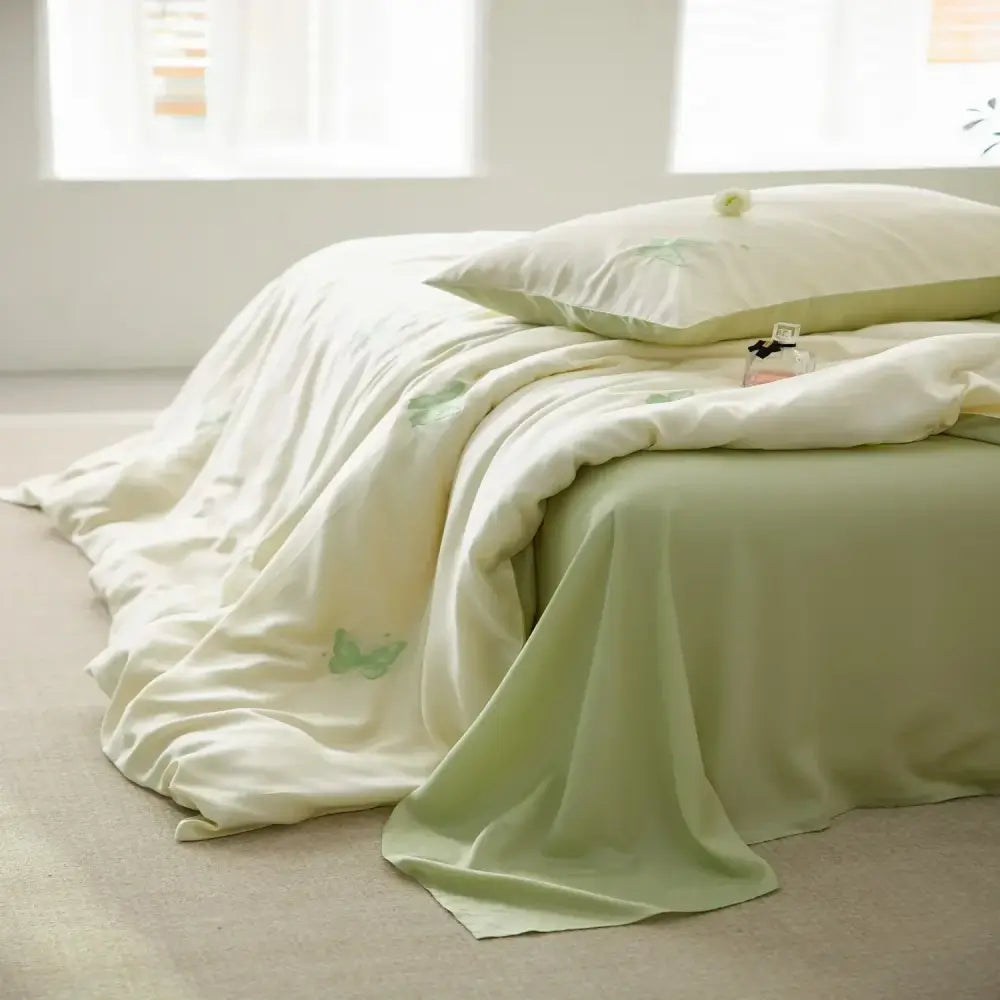 Cream comforter set with green cartoon embroidery and matching pillowcase featuring decorbites cartoon embroidery design