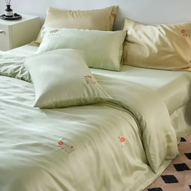 Soft mint-green satin comforter set with delicate cartoon embroidery sun and plant motifs by decorbites cartoon embroidery