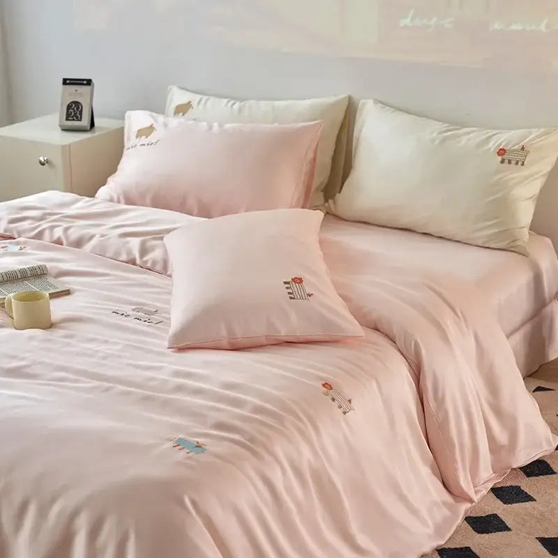 Soft pink satin comforter set with delicate cream and green decorbites cartoon embroidery motifs for bedroom decor