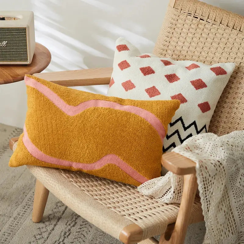 Mustard yellow rectangular embroidered cushion cover with soft pink wavy stitched border for living room decor