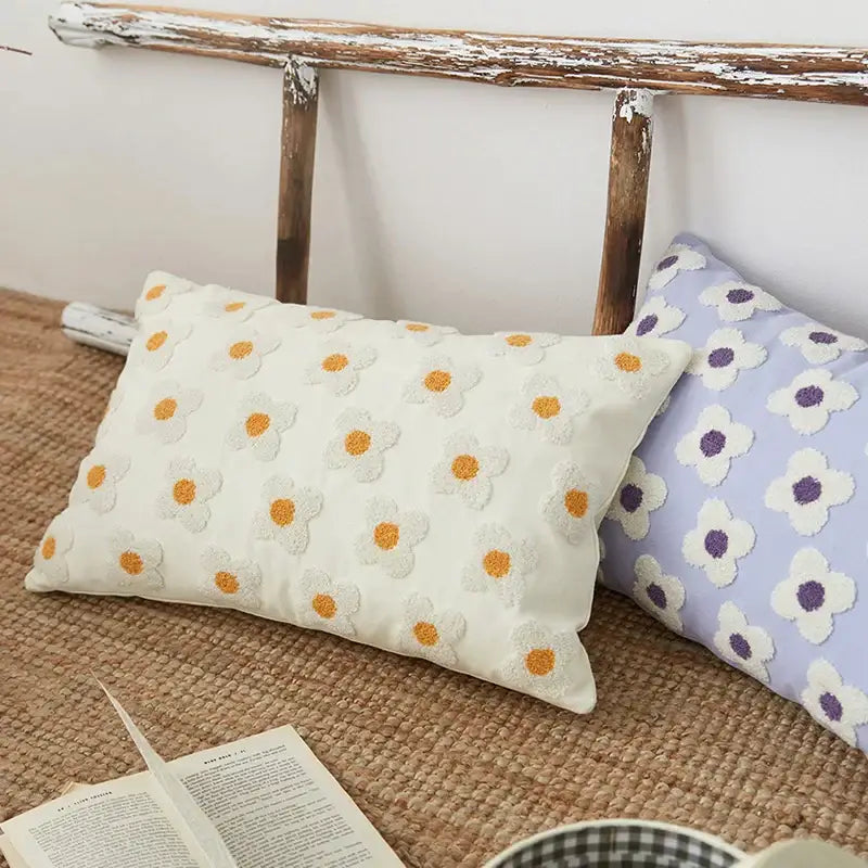 White rectangular embroidered cushion cover with orange centered daisy flowers for living room decor
