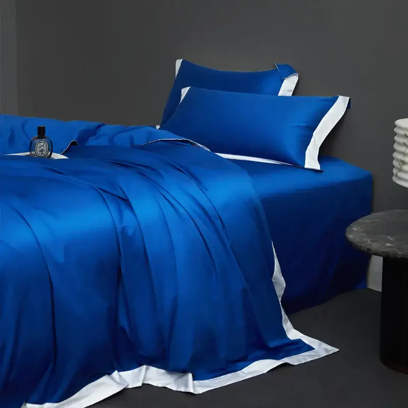 Royal blue satin bedding set with white piping in cream and lavender egyptian cotton hotel style bedroom